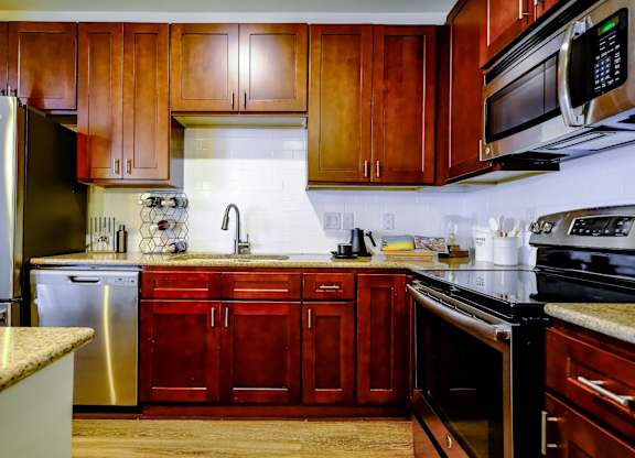luxury kitchen with stainless steel appliances at Berkshire Village District apartments in Raleigh