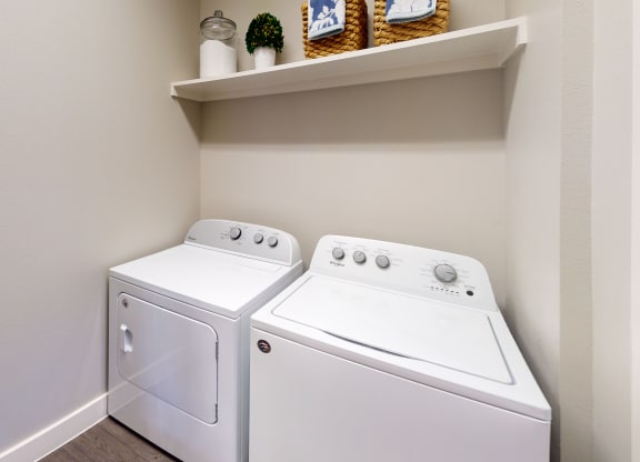 the laundry room has a washer and dryer