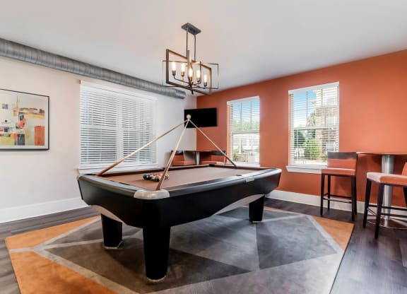 Village at Marquee Station apartments social area with billiards