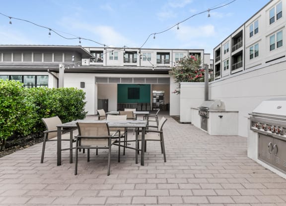 The Callie apartments outdoor grilling and al fresco-style dining area