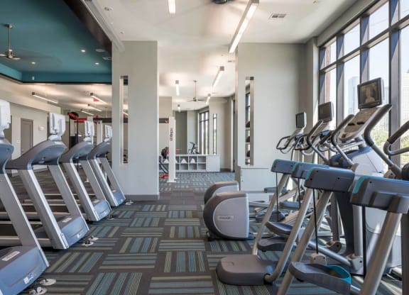 a fitness center with cardio equipment at Tinsley on the Park apartments