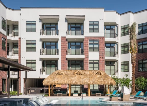 exterior view and swimming pool at Tinsley on the Park apartments
