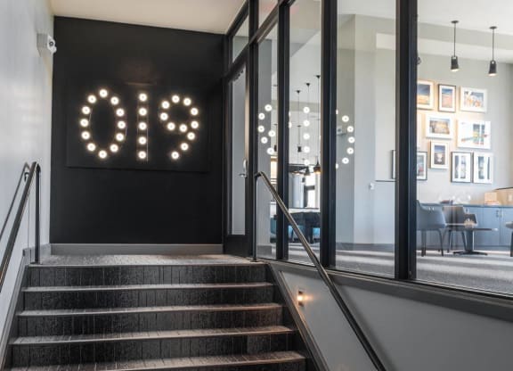 a staircase in the lobby at Tinsley on the Park apartments