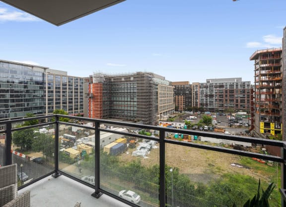 a balcony with a glass railing at Tribeca NOMA apartments