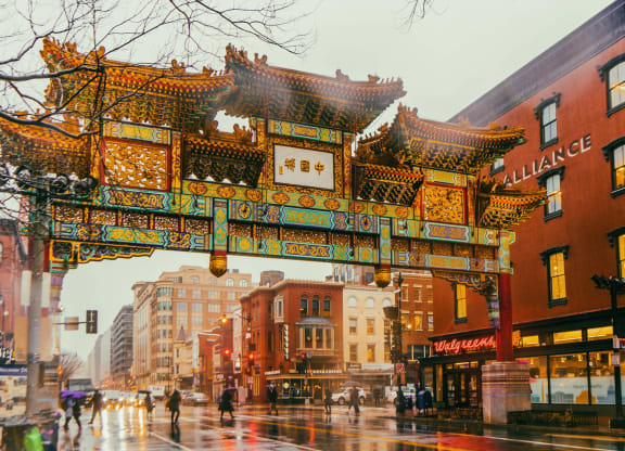 the archway of the chinatown gate on a rainy city street
