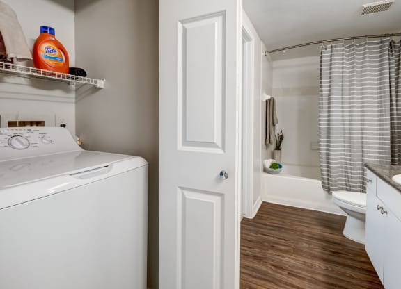 Full sized washer and dryer with hard surface flooring, Plaza Museum District