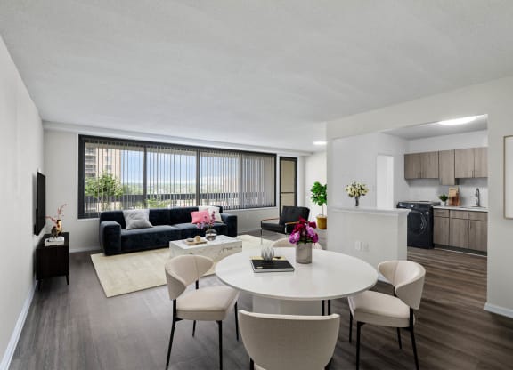 Skyline Towers spacious apartment with a living room and dining room with a white table and chairs