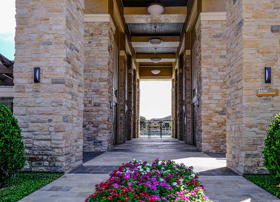 serene outdoor pathway at The Falls at Copper Lake apartments