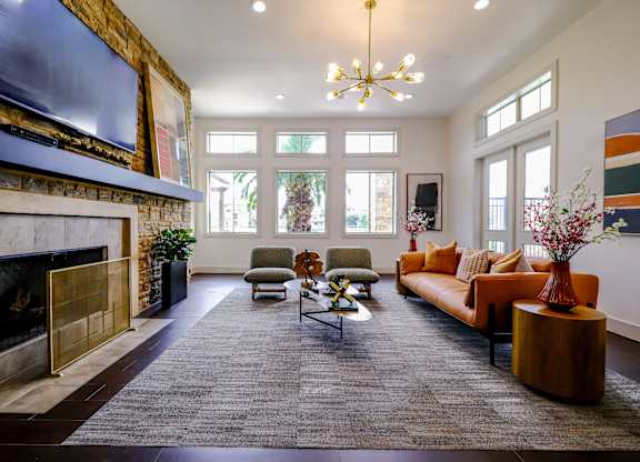 social lounge with a fireplace at The Falls at Copper Lake apartments