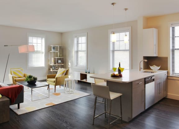 Interior Kitchen with Prep Island and Open-Concept Living and Dining Area at Gatehouse 75, Charlestown, 02129
