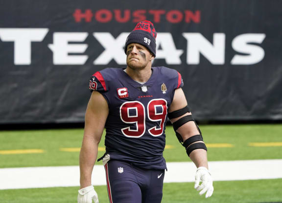 football player walks on the field before a game