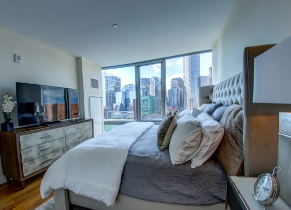 The Benjamin Seaport Residences-Primary Bedroom with Waterfront View and En-Suite Bath