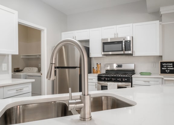 Kensington Grove apartments kitchen with white cabinets