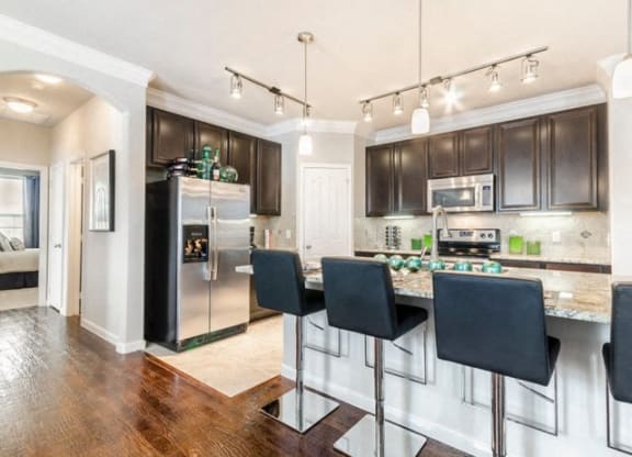 Fitted Kitchen With Island Dining at Villages of Briggs Ranch, San Antonio, 78245