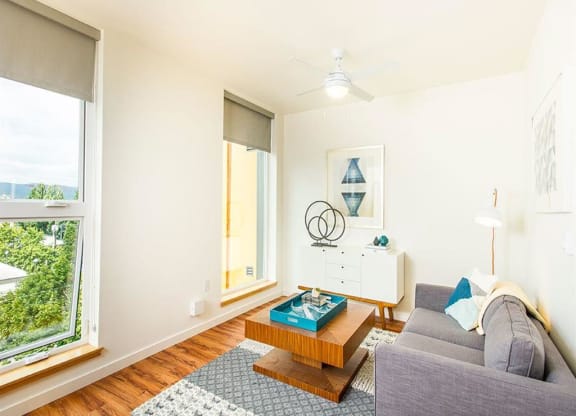 Living Room With Expansive Window at Lower Burnside Lofts, Portland