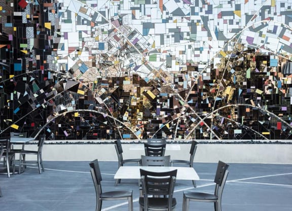 Outdoor art installation with chairs and cafe tables at Lyric, California