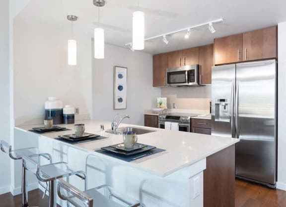 View of kitchen and breakfast bar at Lyric, California, 94596