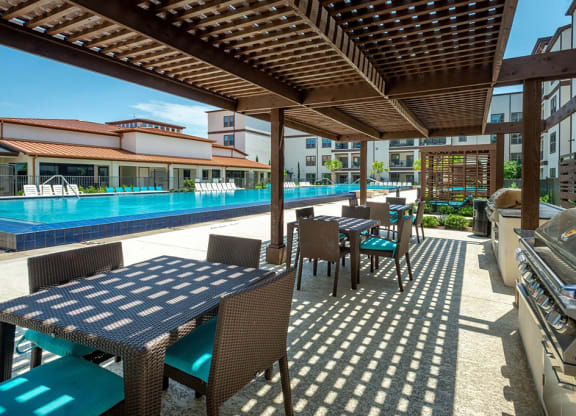 Swimming Pool Area With Shaded Chairs