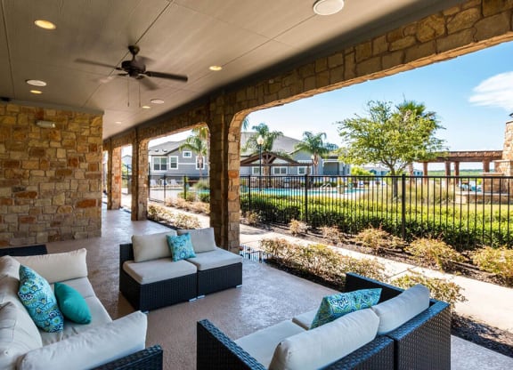 Lounging By The Pool at Villages of Briggs Ranch, San Antonio, 78245