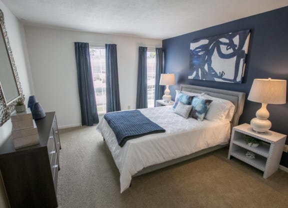 Spacious bedroom with expansive windows Kensington Grove apartments