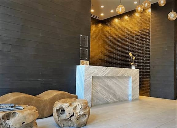 a lobby with a reception desk at Tribeca NOMA apartments