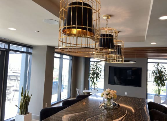 a conference room with large light fixtures at Tribeca NOMA apartments