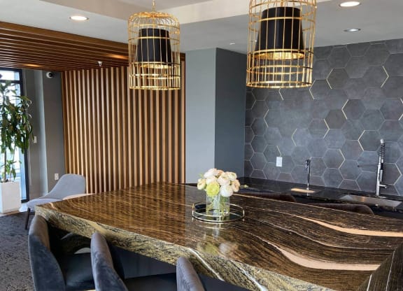 a conference room with a large table and luxurious chairs in Tribeca NOMA apartments