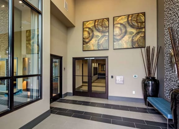 a large lobby with paintings in Reveal Hackensack apartments