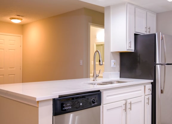 a kitchen with white cabinets