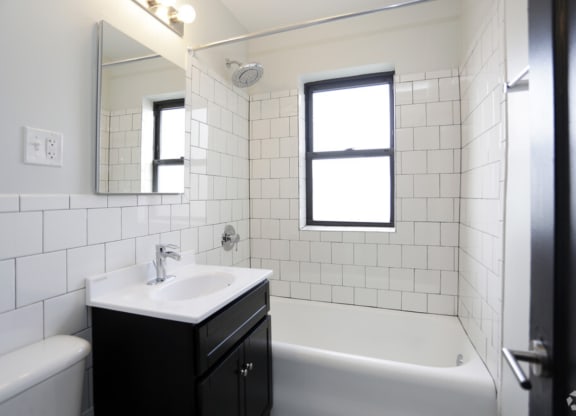 The Edison apartments bathroom with tile backsplash