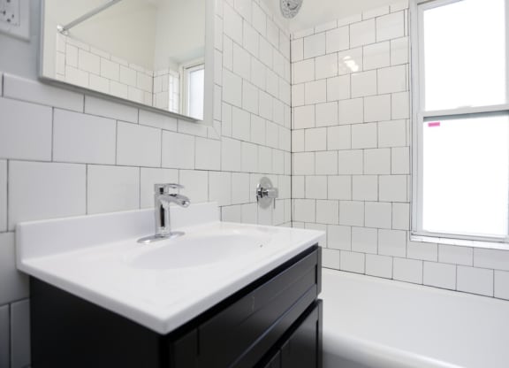 The Edison apartments bathroom with tile backsplash