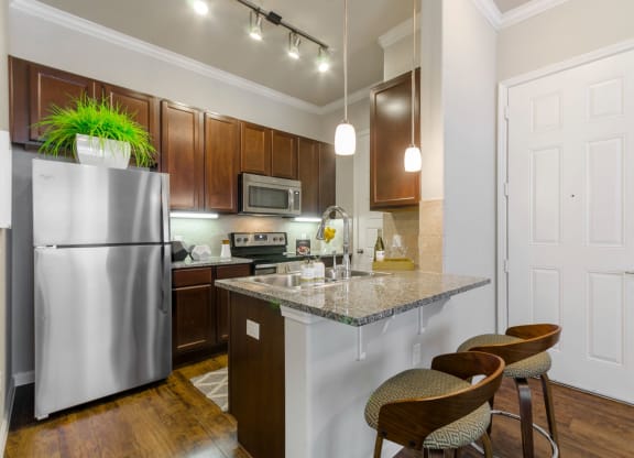 Kitchen appliances and table top at ParkThe Estates 3Eighty, Aubrey, TX