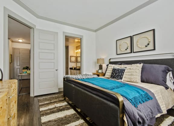 Bedroom with comfy bed at Reveal at Bayside, Rowlett, Texas