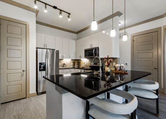 Dining area with lights at Reveal at Bayside, Texas