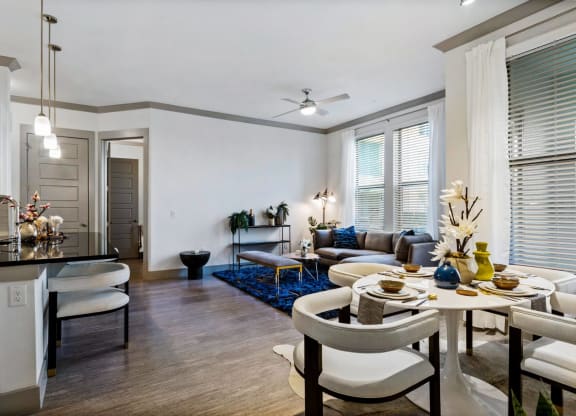 Living room with dining and kitchenat Reveal at Bayside, Rowlett, TX, 75088