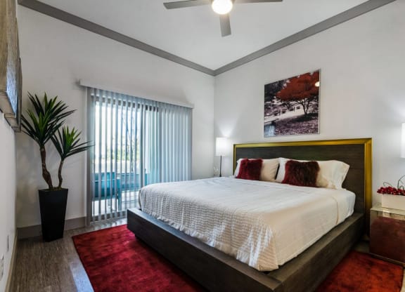Bedroom with bed and indoor plant at Reveal  at Bayside, Texas
