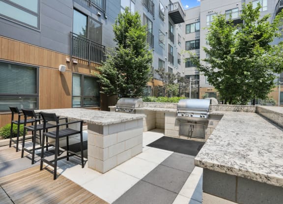 Trellis House apartments outdoor grilling area with al fresco dining