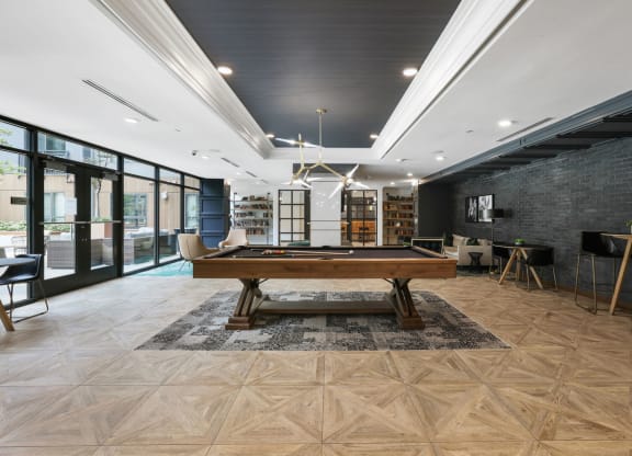 Trellis House apartments social lounge with billiards, comfortable seating and conversation areas