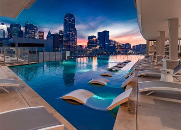 infinity pool with Dallas city views at The Gabriella apartments