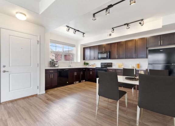Dining Area With Kitchen View at Belle Creek Commons, Colorado