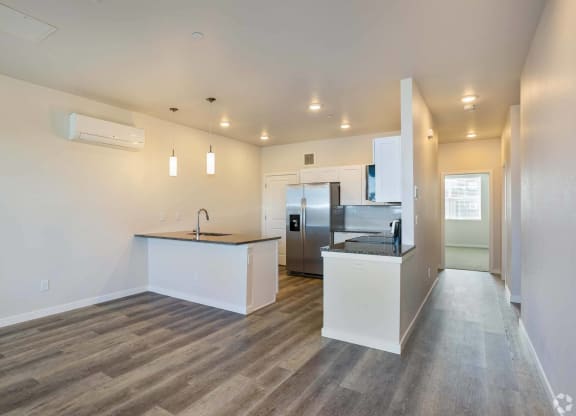 large open kitchen with granite counters at Brownstones at Palisade Park, Broomfield,  Colorado