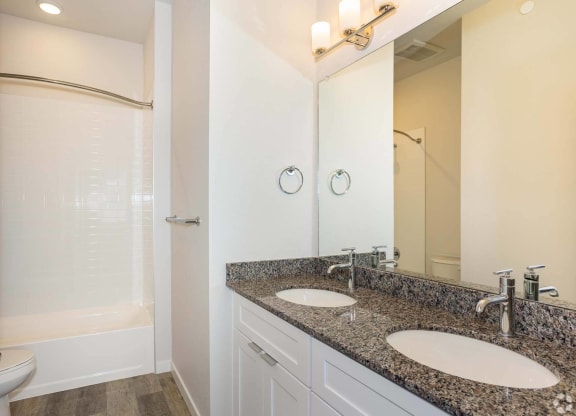 double vanity bathroom with white shower at Brownstones at Palisade Park, Broomfield, CO,  80023