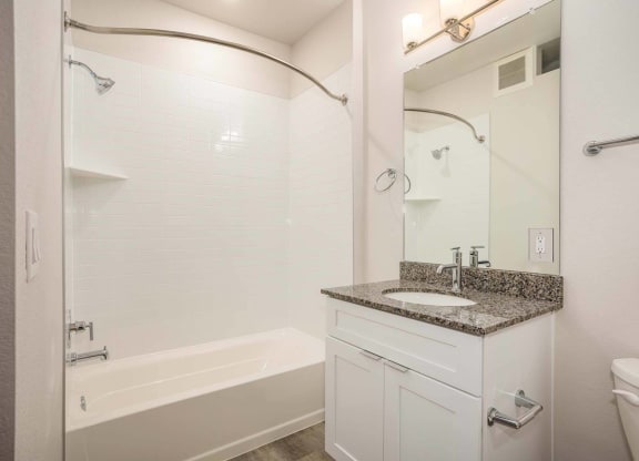 Bathroom with bathtub and shower at Brownstones at Palisade Park, CO, 80023