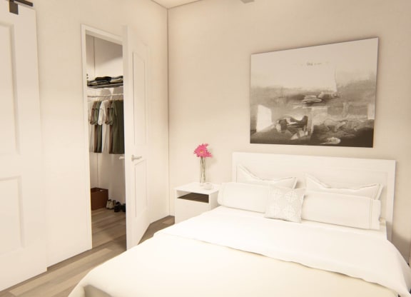 bedroom with large bed and a closet at Brownstones at Palisade Park, Broomfield
