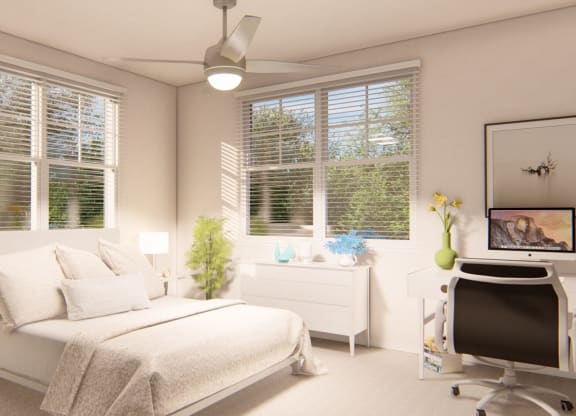 Bedroom with desk and oversized windows at Brownstones at Palisade Park,  Colorado