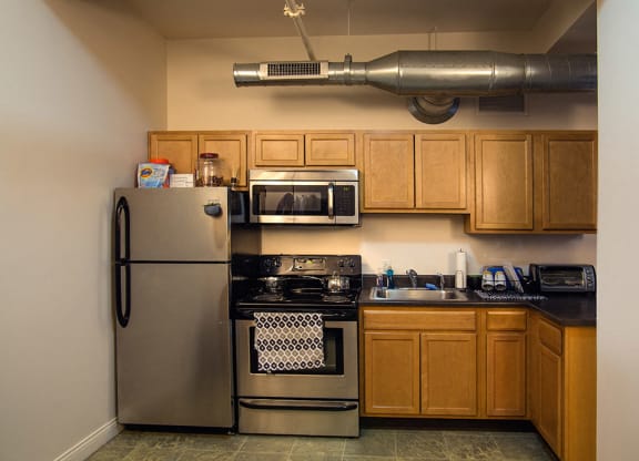 Spacious kitchen with appliances at the Lofts at 5 Lyon, in downtown Grand Rapids, MI