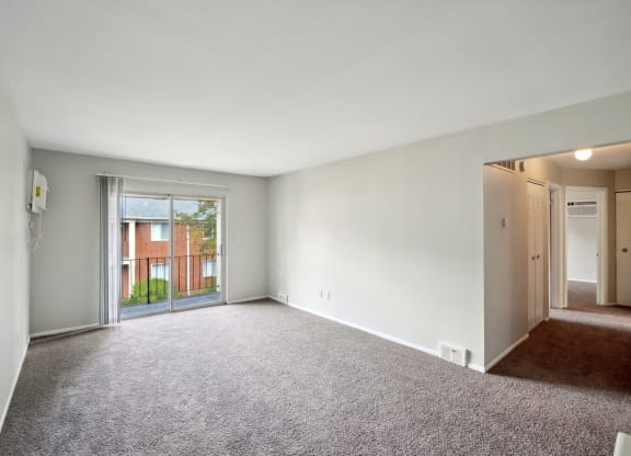 Spacious living room with natural light at Riverstone Apartments in Southfield, MI