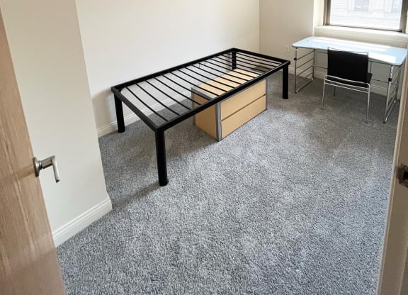 bedroom with bed frame at The Lofts at 5 Lyon, in downtown Grand Rapids, MI