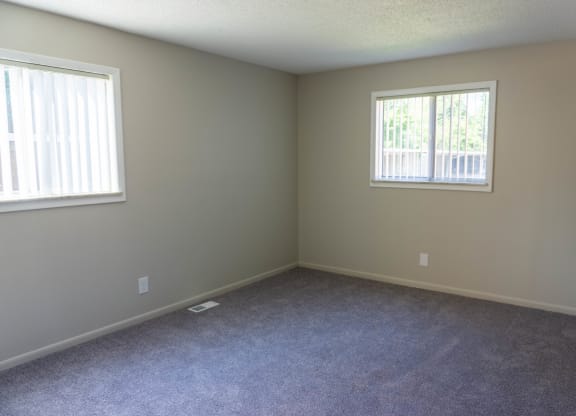 Spacious bedroom at Carriage House Apartments in Flint, Michigan