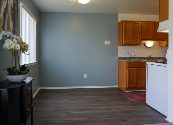 Open Dining Room with hardwood floors and easy access to Kitchen, at Gale Gardens Apartments